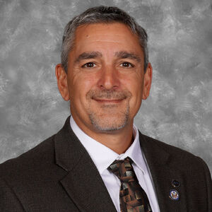 Mr. Christopher Poulos